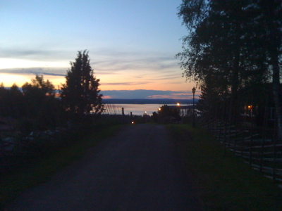 The midnight sun over Tällberg, with Lake Siljan in the distance.